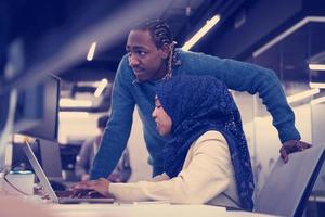 young black muslim female software developer at work photo