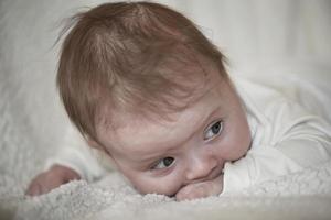 happy newborn little baby smilling photo