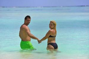 happy young  couple at summer vacation have fun and relax at beach photo