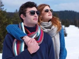 happy young couple having fun on fresh show on winter vacation photo