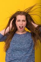 pretty woman playing with her long silky hair photo