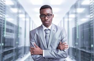 Young  black man in server room photo