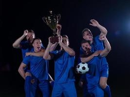 soccer players celebrating victory photo