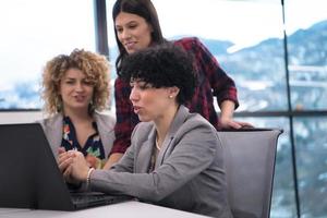 female software developers using laptop computer photo