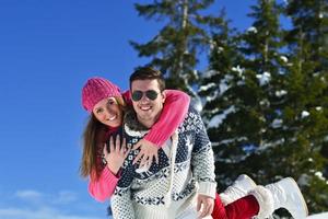 young couple on winter vacation photo