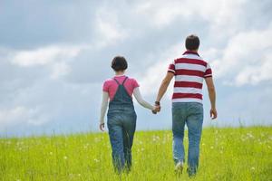 Portrait of romantic young couple smiling together outdoor photo