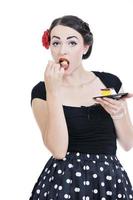 beautiful young woman eat sweet cake photo