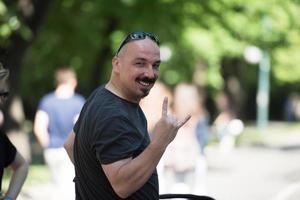 man showing a rock hand gesture photo