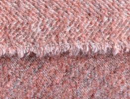 Detailed close up view on samples of cloth and fabrics in different colors found at a fabrics market photo