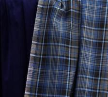 Detailed close up view on samples of cloth and fabrics in different colors found at a fabrics market photo