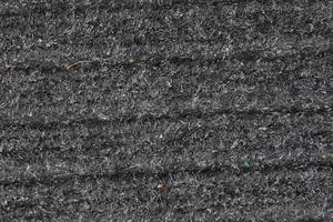 Detailed close up view on samples of cloth and fabrics in different colors found at a fabrics market photo