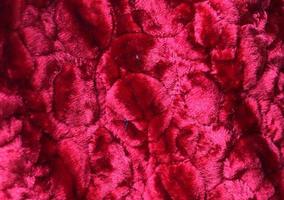 Detailed close up view on samples of cloth and fabrics in different colors found at a fabrics market photo