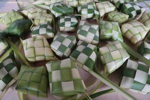 Ketupat or Rice Dumplings. Ketupat is a natural rice sleeve made from young coconut leaves to cook rice which is always available during Islamic holidays photo