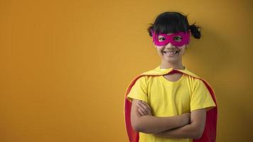 The little girl child in a superhero costume photo