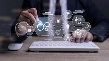Business process management concept. Businessman touch on virtual innovation Operations management gears icons, High quality control , Problem solving, workflow, monitoring and innovation. photo