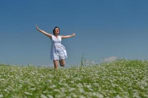 Young happy woman in green field photo