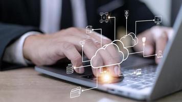 Businessman with cloud computing diagram show on hand. Cloud technology. Data storage. Networking and internet service concept. photo