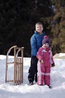 Brother and sister portrait in winter time photo