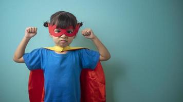 The little girl child in a superhero costume photo