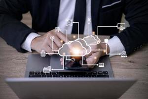 Businessman with cloud computing diagram show on hand. Cloud technology. Data storage. Networking and internet service concept. photo