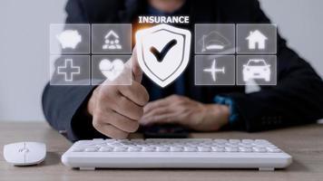 insurance concept on virtual blue screen with icons photo