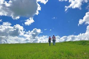 Portrait of romantic young couple smiling together outdoor photo