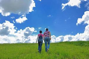 Portrait of romantic young couple smiling together outdoor photo