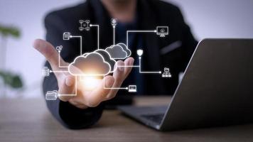 Businessman with cloud computing diagram show on hand. Cloud technology. Data storage. Networking and internet service concept. photo