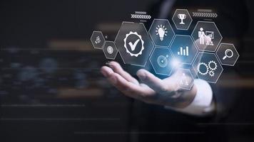 Business process management concept. Businessman touch on virtual innovation Operations management gears icons, High quality control , Problem solving, workflow, monitoring and innovation. photo