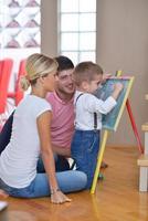 family drawing on school board at home photo