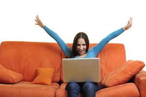 woman using a laptop computer at home photo