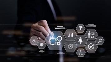 Business process management concept. Businessman touch on virtual innovation Operations management gears icons, High quality control , Problem solving, workflow, monitoring and innovation. photo