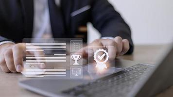 A businessman operating with the quality assurance, guarantee, standards, ISO certification, and standardization notion as proof of top service. photo