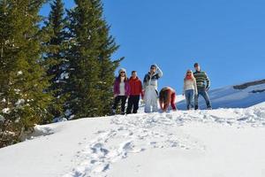 friends have fun at winter on fresh snow photo