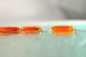 isolated wet zen stones with splashing  water drops photo