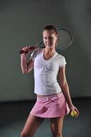 Playing tennis indoors photo