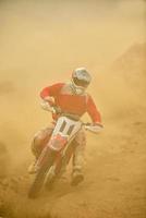 Riding a motocross bike photo