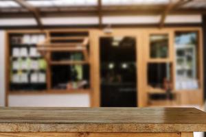 Empty dark wooden table in front of abstract blurred bokeh background of restaurant . can be used for display or montage your products. photo