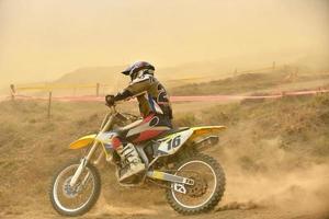 Riding a motocross bike photo