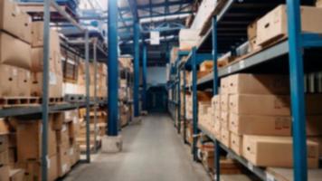 Passageway in a huge distribution warehouse with high shelves. Bottom view. warehouse background concept photo