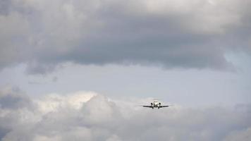 Small regional airliner on final approach before landing. View from the runway's edge video