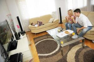 couple at home eating  pizza photo