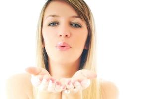 Woman blowing on hands photo