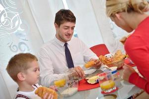 family have healthy breakfast at home photo