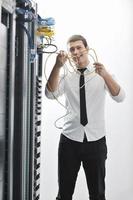 young engeneer in datacenter server room photo