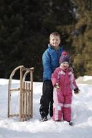 Brother and sister portrait in winter time photo