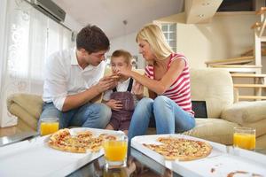 family eating pizza photo