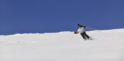 Skiers on mountain photo