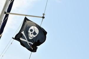 Pirate flag against sky photo