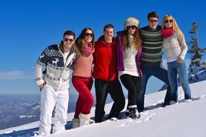 friends have fun at winter on fresh snow photo